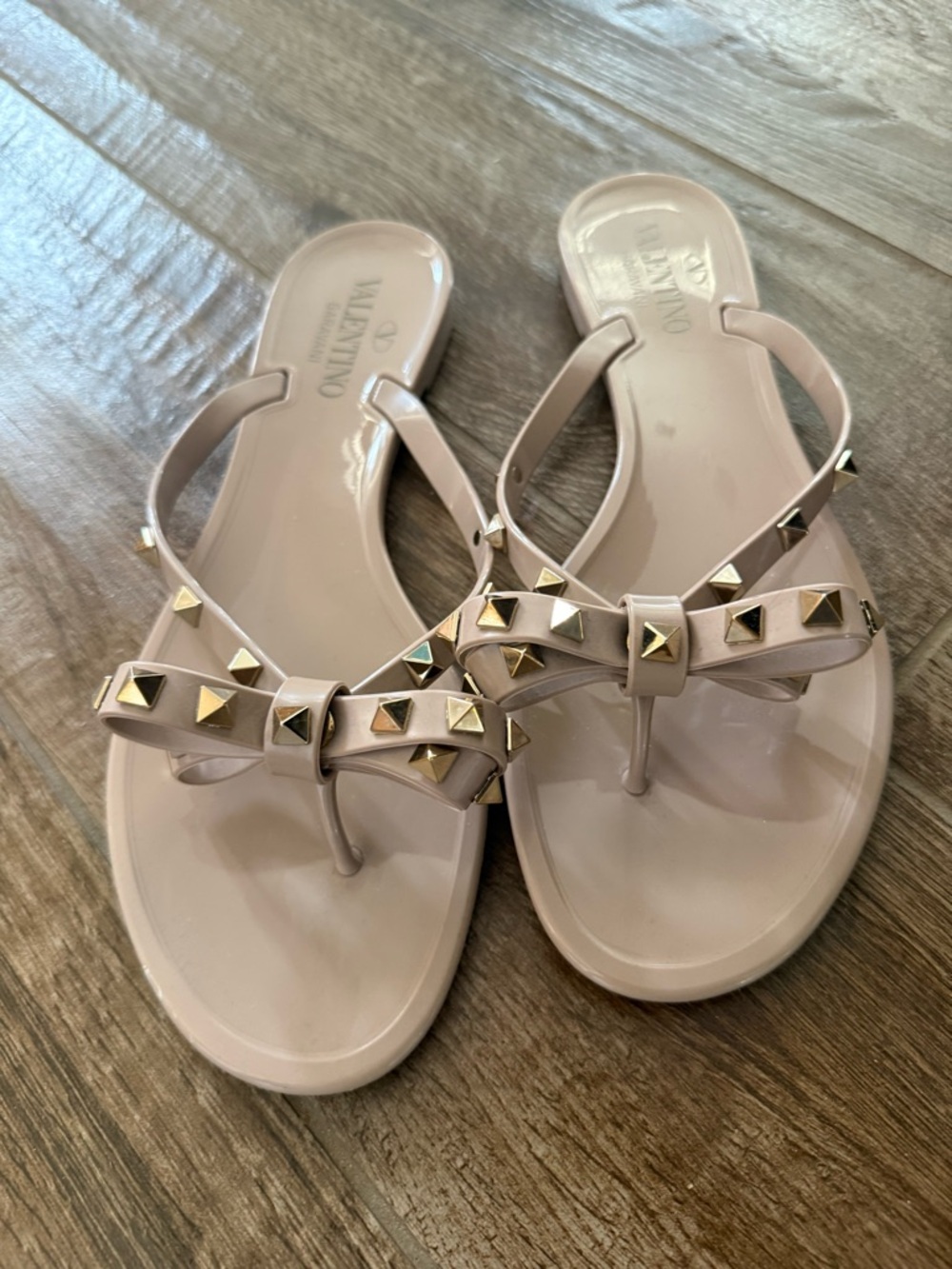 Valentino Bow Jelly Thong Sandals in Blush with Gold Studs
